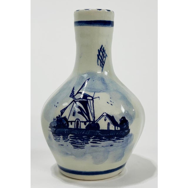 Antique Delft bud vase with hand-painted Dutch windmill and floral pattern. Makers mark on bottom: “Delft Blue Holland."...