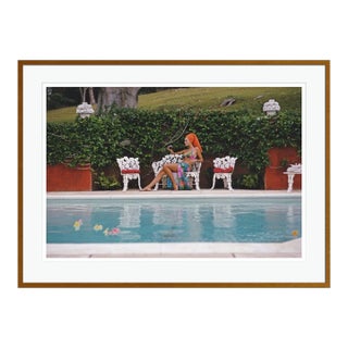 Contemporary Lounging in Bermuda 1969 by Slim Aarons Framed Brown C-Print For Sale