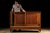 Antique commercial display cabinet constructed from solid wood and fitted with large glass viewing panels. The substantial...