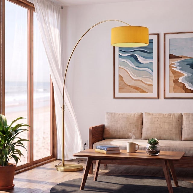 A Peter Morelli original in weathered brass and mustard, designed to float above your favorite room. The Float Arc Lamp is...