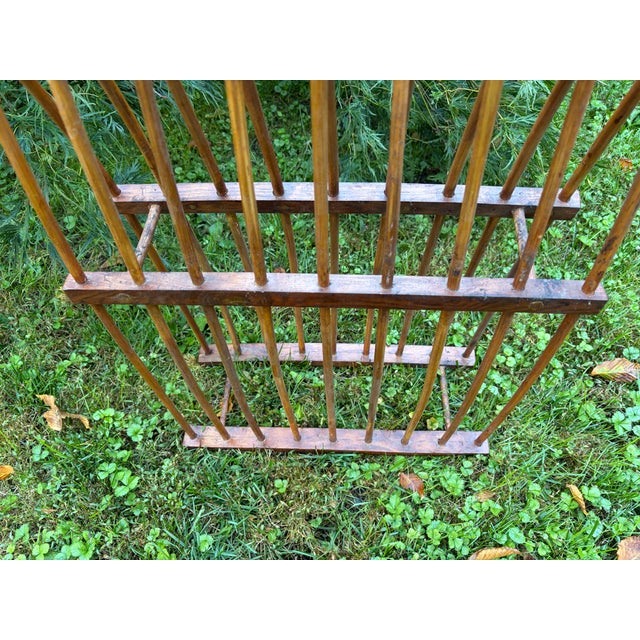 Simple, primitive vintage wooden plate rack. It has 8 slots on the top and bottom. No marks. Structurally sound with some...