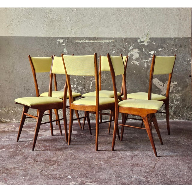 Splendid set of six dining chairs made in the 1950s and attributed to designer Carlo de Carli. Beech wood frame and yellow...