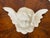 Regency style glazed porcelain cherub with wings wall sculpture.