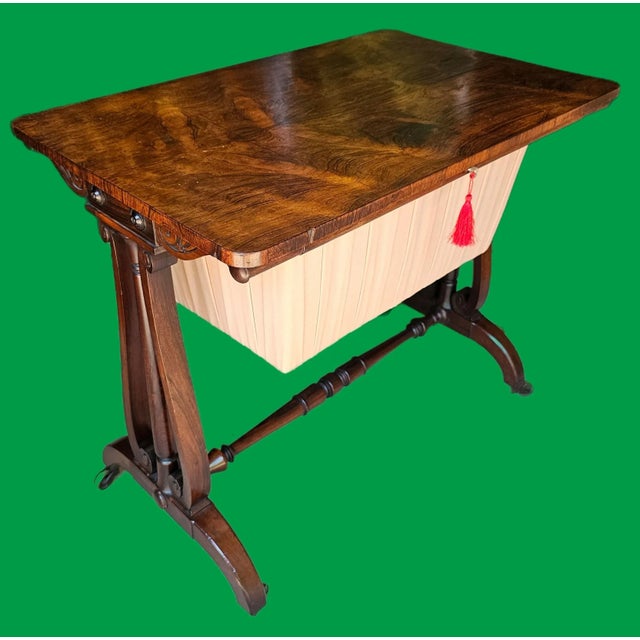This Antique 1830s English Rosewood Sewing Table, with its deep and lustrous rosewood grain, stands as a handcrafted...