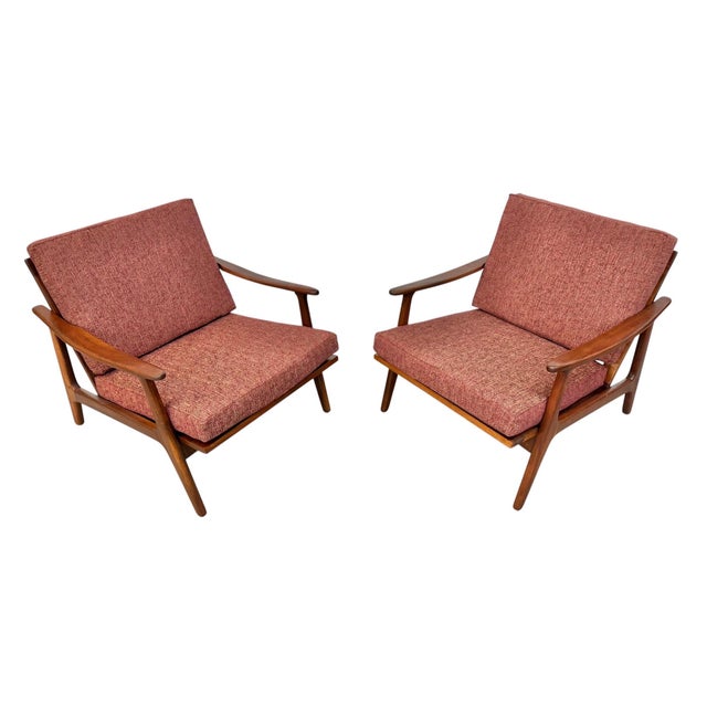 This handsome pair of mid-century modern walnut armchairs embodies the clean lines and organic forms that define classic...