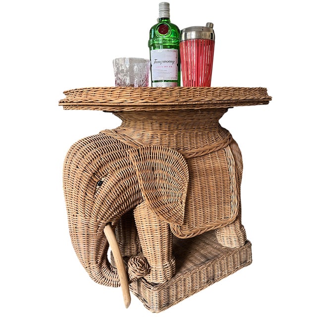 A charming vintage elephant tray table combining sculptural animal form with the warmth and texture of natural woven...