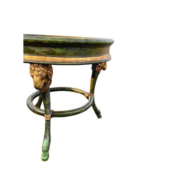 Vintage Green English Regency Rams Head Gilded Occasional Table, Circa 1990’s. In a faux marble green and gold motif. With...