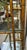 Chinese Chippendale Pagoda-Style Faux-Bamboo Etagere. Patina of bronze gold with bamboo accents. The construction is iron...