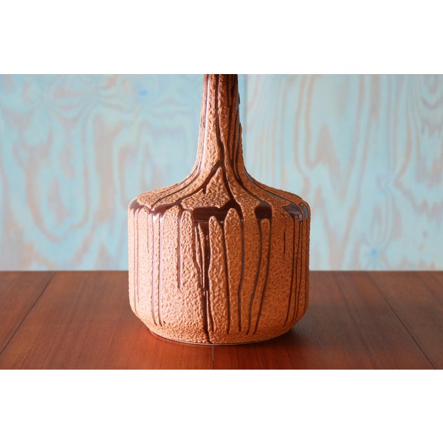 A monumental ceramic table lamp featuring a light pink, taupe and brown colorway of drip lava glaze. Heavy and Tall coming...