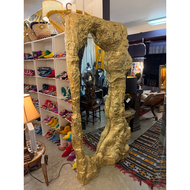 Large cave rock formation resin made mirror. Painted a gold gloss finish and free standing.