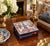 A wonderfully unusual decorative object, this vintage matchbox holder is constructed around a Delft-style ceramic tile...