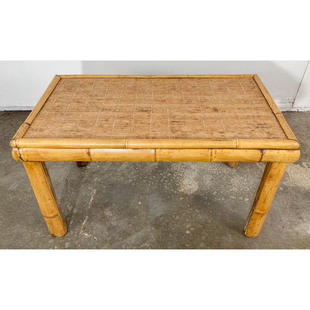 Vintage chunky cut split bamboo table with reed rattan top. The substantial frame is stunning! Sturdy frame and legs. A...