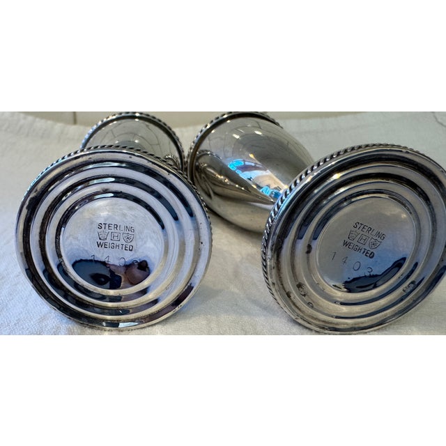 A beautiful pair of sterling antique salt & pepper shakers by M. Fred Hirsch. Unique due to their height. This is a...