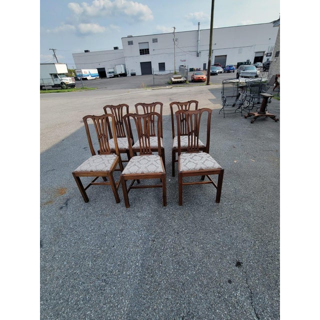 Set of Six English Mahogany Dining Chairs A handsome set of six traditional English-style dining chairs crafted in a rich,...