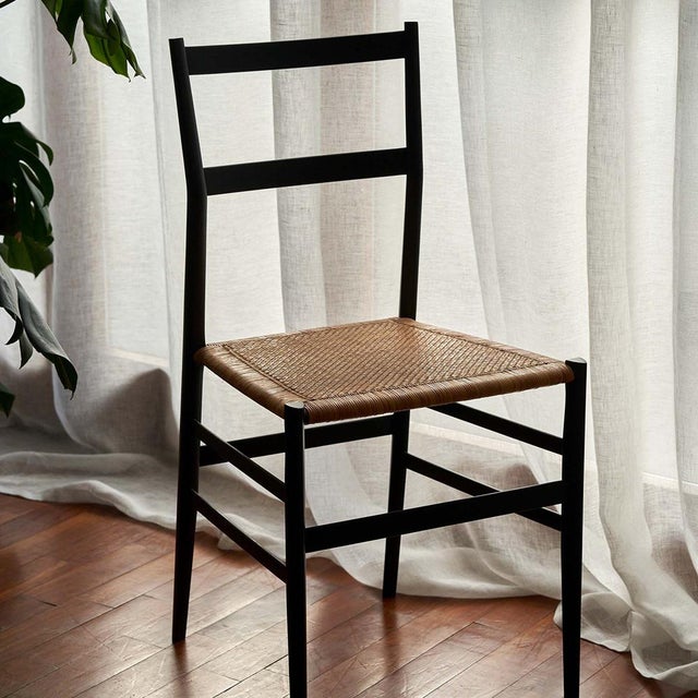 The superleggera represents an icon of global design. Designed in 1957 by Gio Ponti: Version with rattan seat and black...