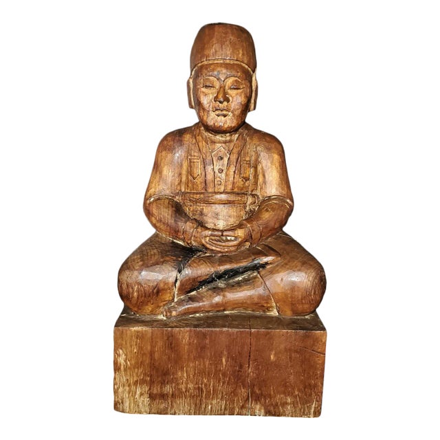 Early 20th Century Indonesian Carved Wooden Seated Gentleman For Sale