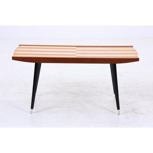 Vintage coffee table from the 1960s Vintage coffee table with decorative striped inlay • Contrasting veneer work in light...