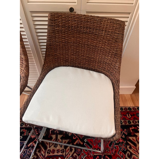 Woven coco abaca. chrome-plated steel base and off white sailcloth shell cushions. Selling both together. Perfect for...