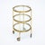 Brass bar cart from the Art Deco period in France. This petite table has three glass shelves, the top of which has handles...
