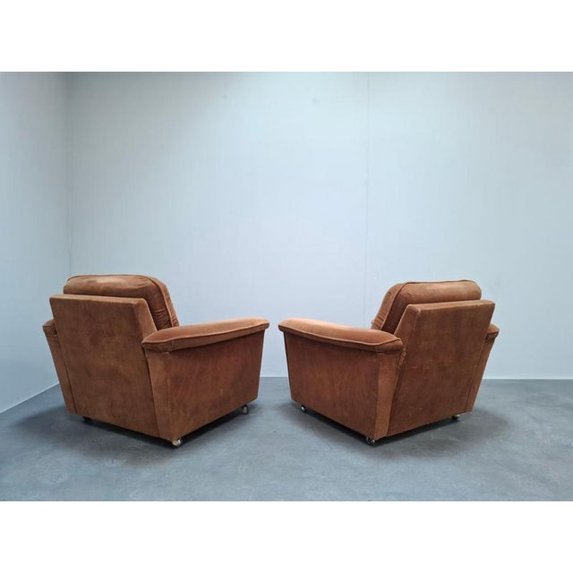 An authentic pair of Mid-Century Modern lounge armchairs manufactured in Czechoslovakia during the mid-20th century. These...