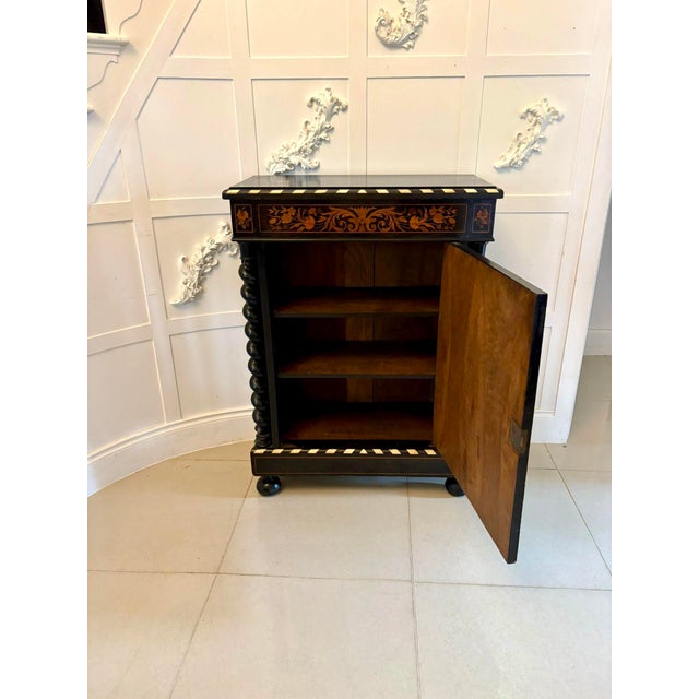 Outstanding quality antique Victorian floral marquetry and ebonised side cabinet having an ebonised top above a floral...