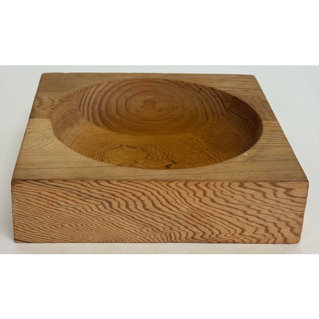 Vintage carved wood catchall bowl featuring square form with spherical dish cutout to center. Solid wood. A wonderful...