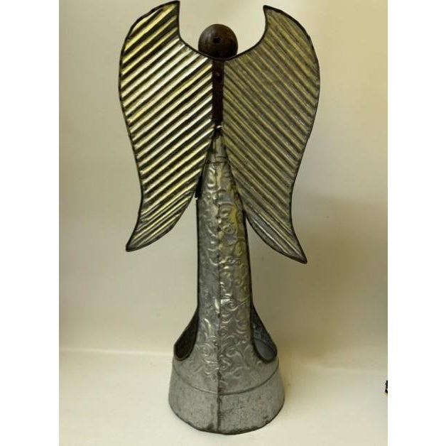 A truly unique and exceptional piece of upcycled assemblage folk art, this large 21-inch standing angel lantern perfectly...