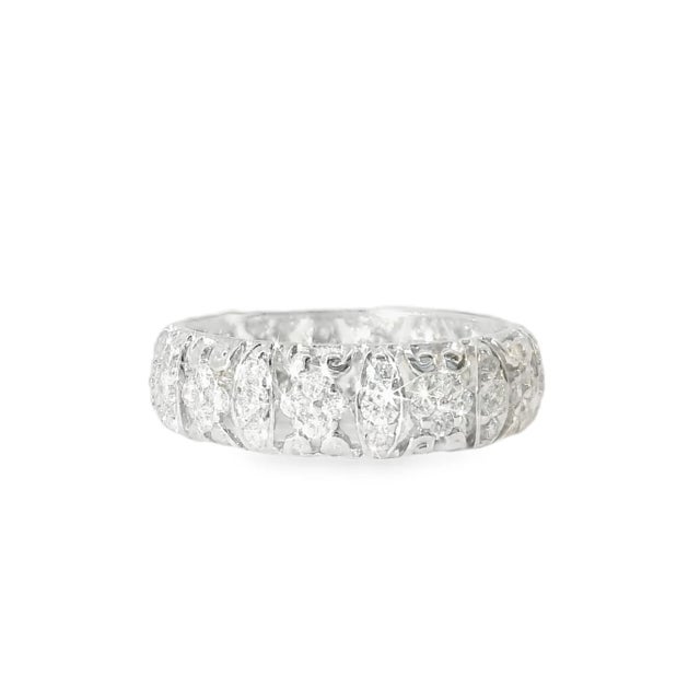 Elegant 14K white gold eternity infinity wedding band featuring numerous brilliant round diamonds totaling 1 carat (G...
