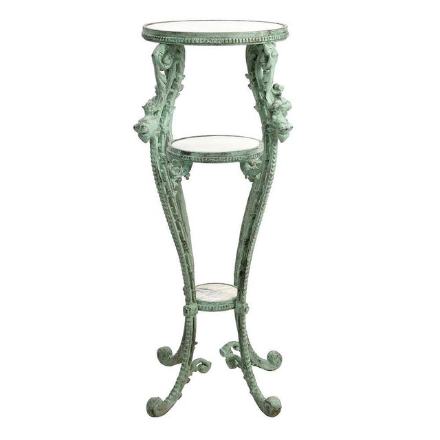 Patinated Cast Iron Side Table with Marble Trays, in Good conditions. This piece is designed in the style of the selected...