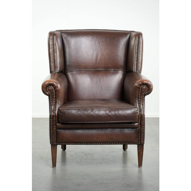 Offered by ByThijs: this beautiful, subtle sheepskin wing armchair with a deep cognac color and a comfortable seat. : This...