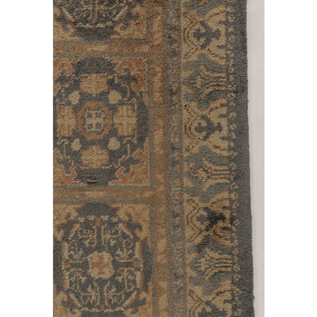 Hand-knotted in wool, this oversized antique Spanish rug sized 12x16, dates to circa 1900-1920. The design features an...