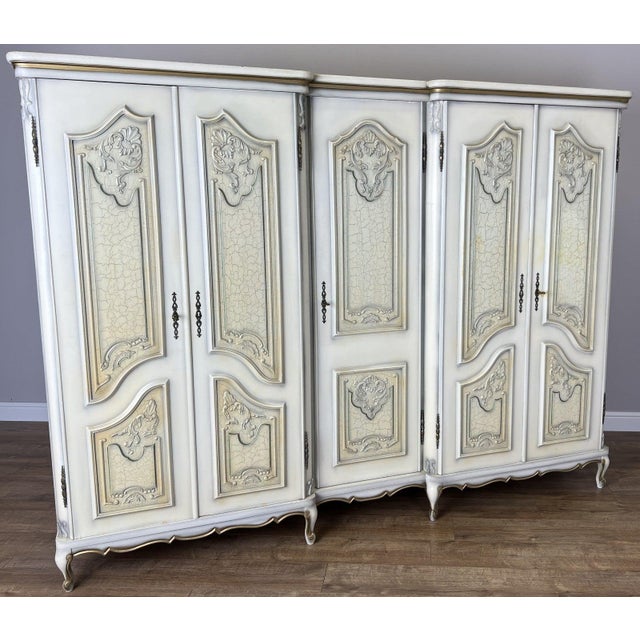 This striking Vintage French Shabby Chic wardrobe offers exceptional storage capacity and elegant decorative styling....