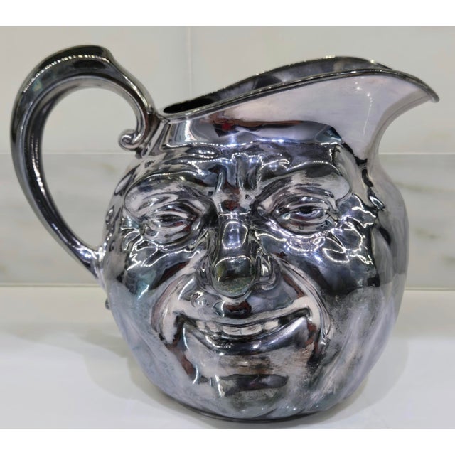Add instant personality to your bar cart with this vintage Reed & Barton “Sunny Jim” silver-plated water pitcher, pattern...