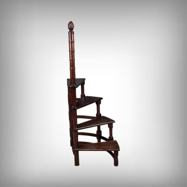 This elegant mahogany library stepladder, crafted in England, captivates with its exquisite workmanship and the nobility...