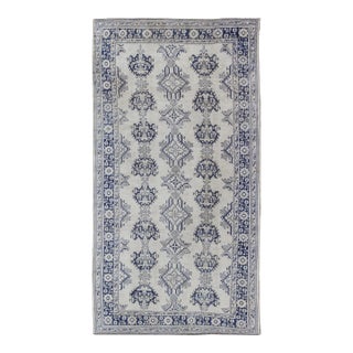 Early 20th Century Navy Blue and Ivory Antique Turkish Oushak Rug With Vertical Geometric Design For Sale