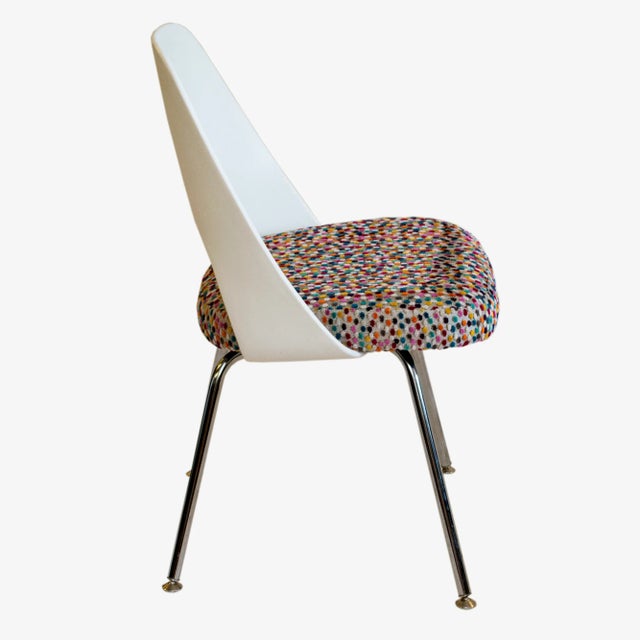 This Eero Saarinen for Knoll plastic-back side chair was reupholstered in a super fun mutli-color dot fabric. We offer...