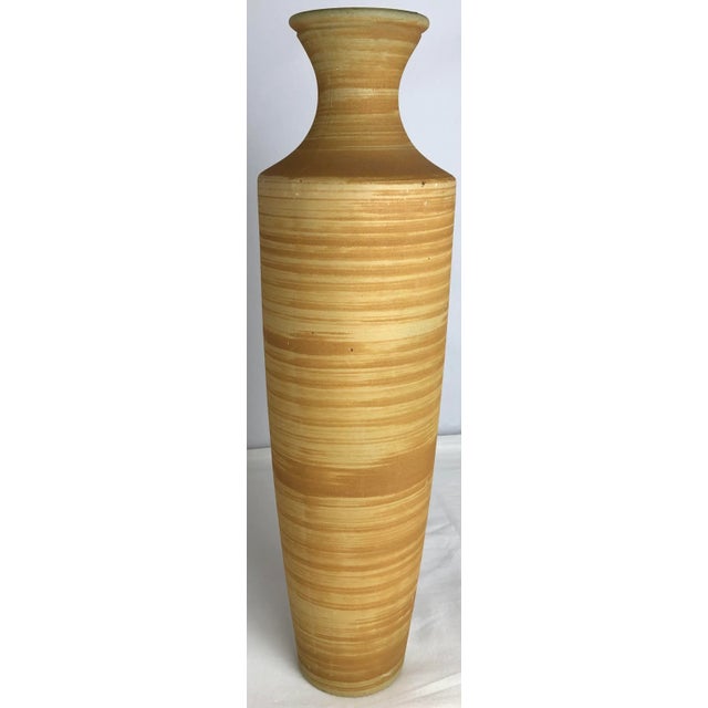 Elegant pair of mid-century modern art glass vases, crafted from art glass in a captivating palette of sunshine yellow and...