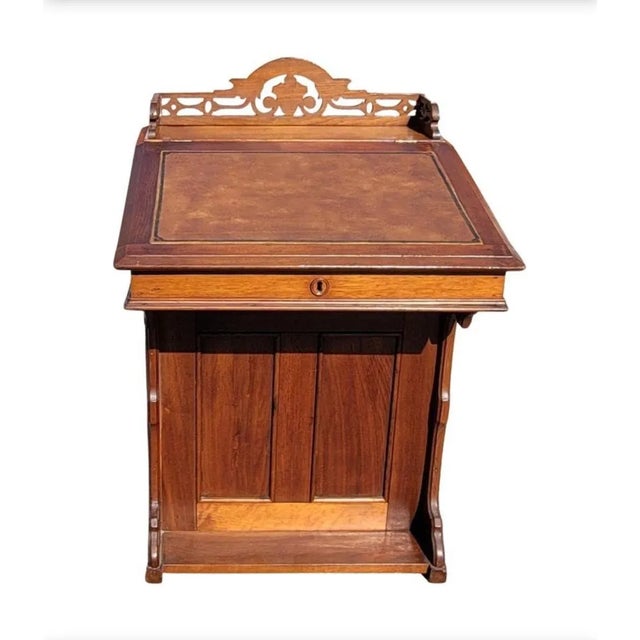 An exceptional 5-Drawer Mahogany Davenport Desk With Tooled Leather Top and Gallery. The Davenport desk, sometimes...