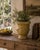 A handsome late 20th century French Provincial earthenware planter with a warm ochre glaze, softly crackled surface, and...