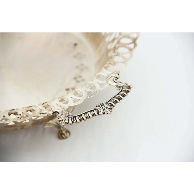 Circular Silver Fruit Bowl with Wire Rack, in Very Good conditions. Designed 1920 to 1949 This piece has an attribution...