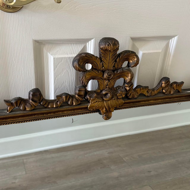 Bring authentic pre-war luxury into your home with this stunning antique May 1940 giltwood wall mirror manufactured by the...