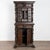 Heavily carved baroque walnut cabinet with putti, faces, flourishes and more. Top has two exterior drawers, middle section...