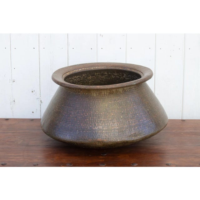 Magnificent large antique copper water pot from Southern India—an enduring testament to a bygone era when such vessels...