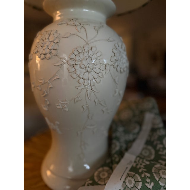 A timeless vintage lamp, thoughtfully restored and paired with a handcrafted lampshade in a soft sage botanical linen. The...