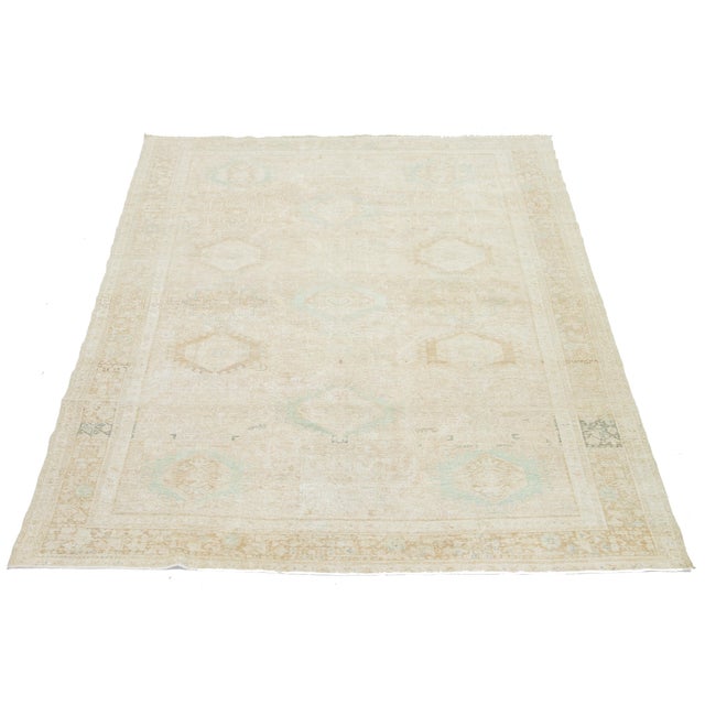 This exquisite antique Persian Heriz wool rug showcases a captivating green design that beautifully enhances a luxurious...