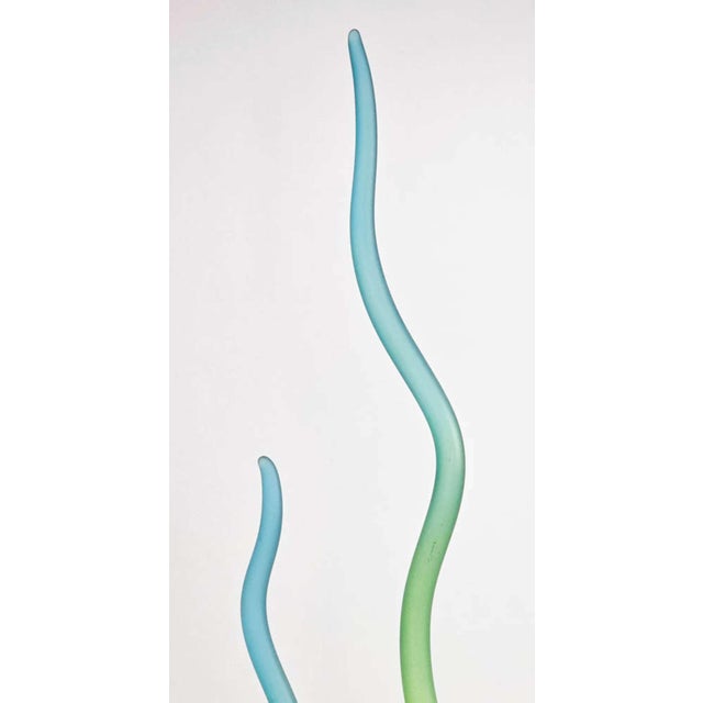I’m selling a vintage frosted Art glass pulled floral or flower and stem sculpture. It is set on a black base and the...