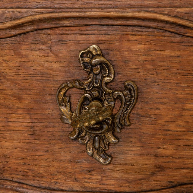This mid-19th century French Louis XV chest of drawers dates to the 1850s and exemplifies the elegance and fluidity of the...
