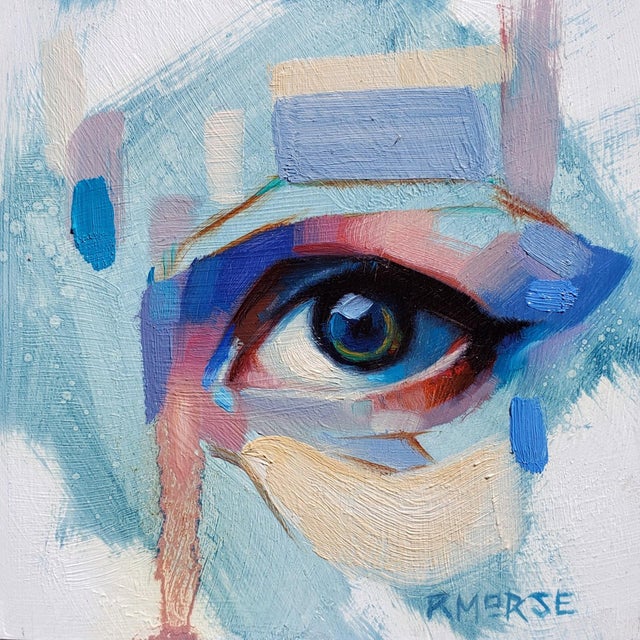 The artwork features a close-up of an eye, rendered in a palette dominated by soft blues and subtle earth tones, creating...