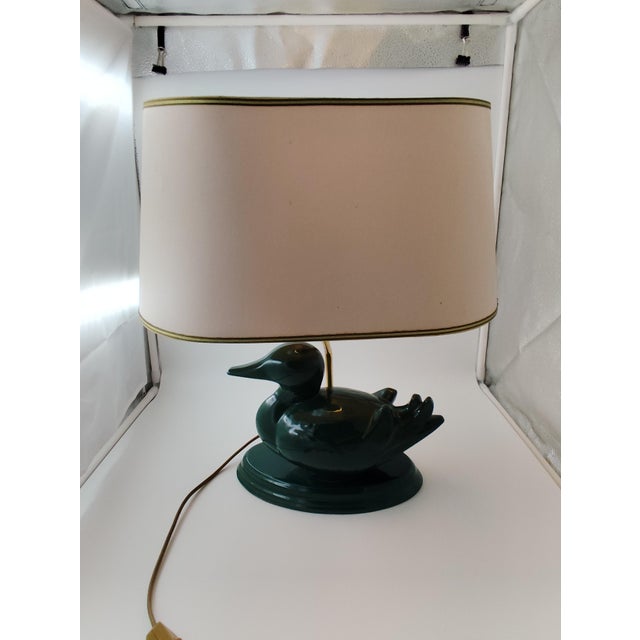 Beautiful, rare table lamp from Goebel. Green porcelain duck with a beige lampshade. This piece has an attribution mark, I...