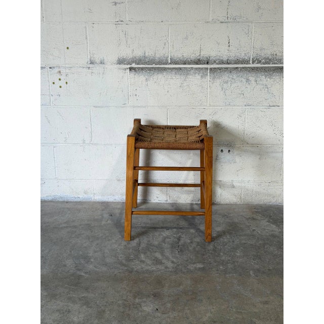 This vintage oak stool features a square woven paper cord seat atop a sturdy four-legged base. Clean lines and tactile...